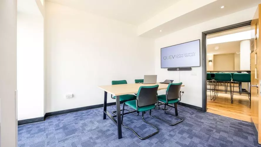 Meeting Room 02 laid out boardroom for a small meeting