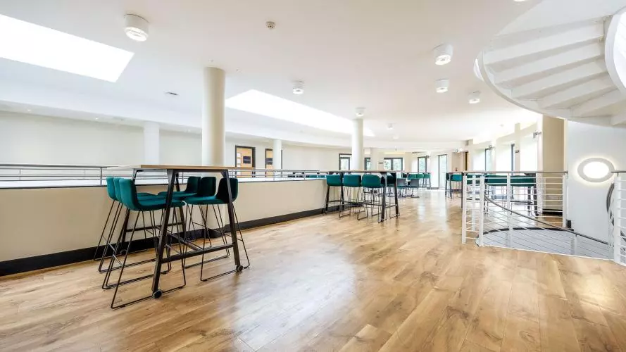First Floor Mezzanine - event pace laid out for an informal event with high tables and bar stools